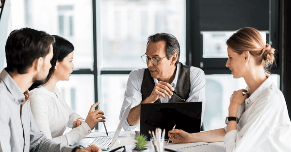 Four people in a meeting